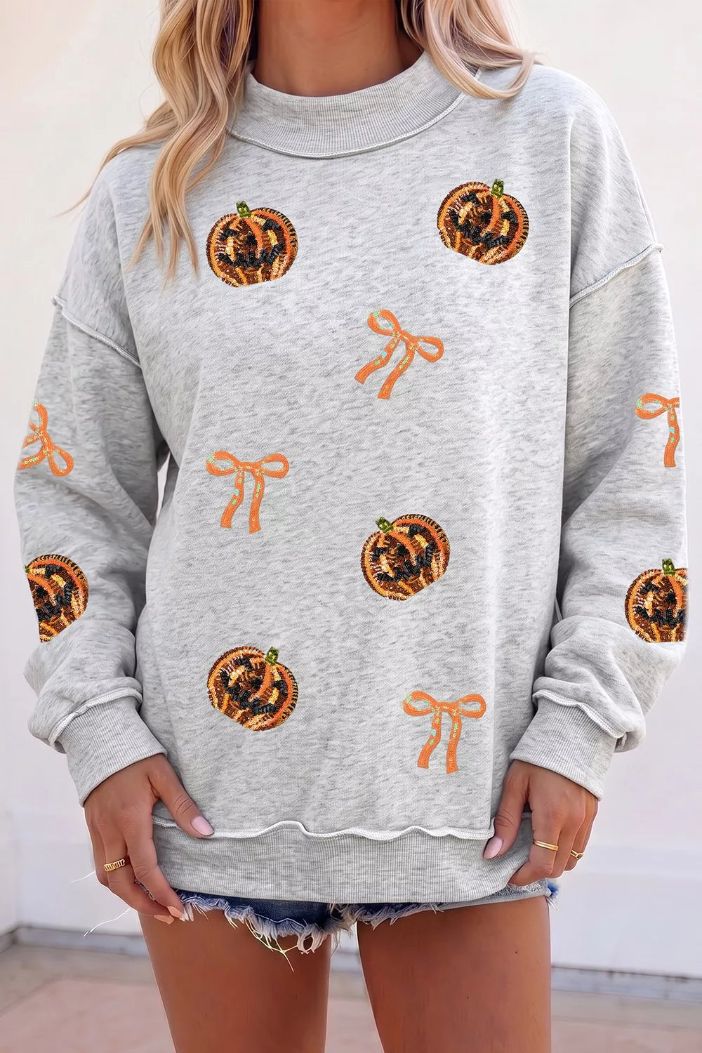 Sequin Pumpkin Face Bow Exposed Seam Halloween Sweatshirt - Lilixa.store