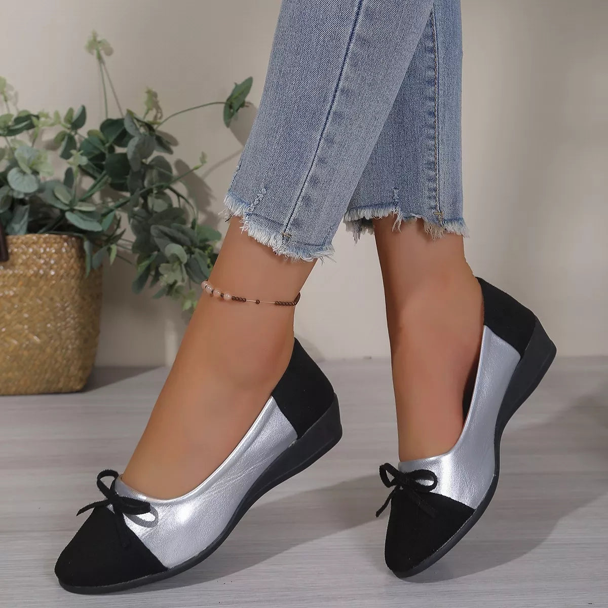 Bow Accent Two-Tone Slip-Ons in Black
