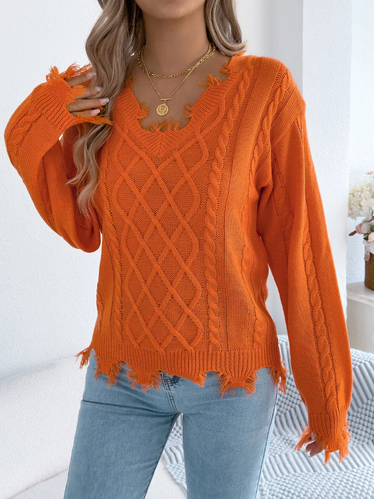 V-Neck Distressed Hem Cable Knit Sweater