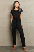 Perfee Boat Neck Short Sleeve Jumpsuit with Pockets in Black