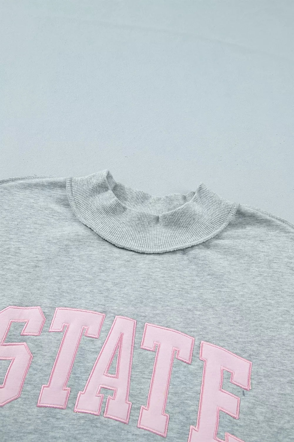 Exposed Seam Mock Neck STATE Letter Graphic Loose Sweatshirt
