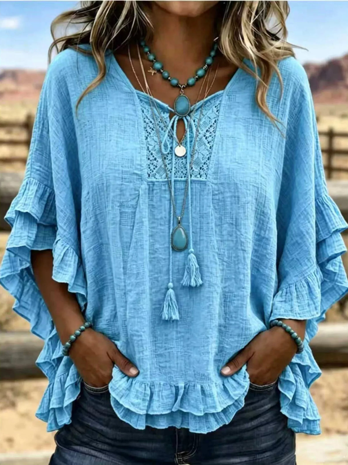 Full Size Tassel Tie Neck Ruffled Hem Blouse Plus Size - Lilixa.store
