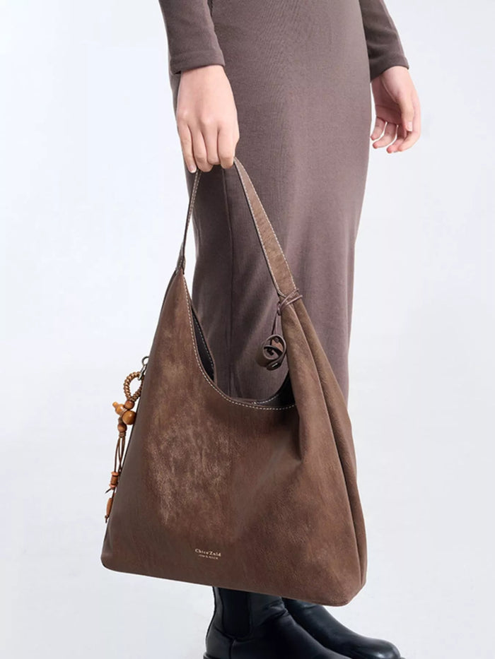 Suede Hobo Shoulder Bag with Decorative Tassel in Brown