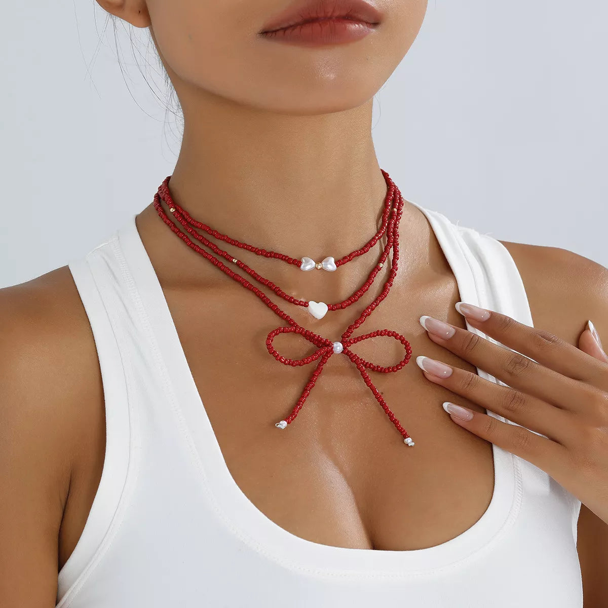 Beaded Bow Necklace with Heart Pendants - Lilixa.store