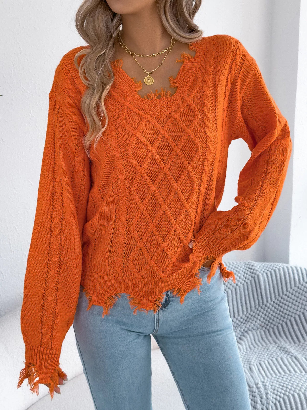 V-Neck Distressed Hem Cable Knit Sweater