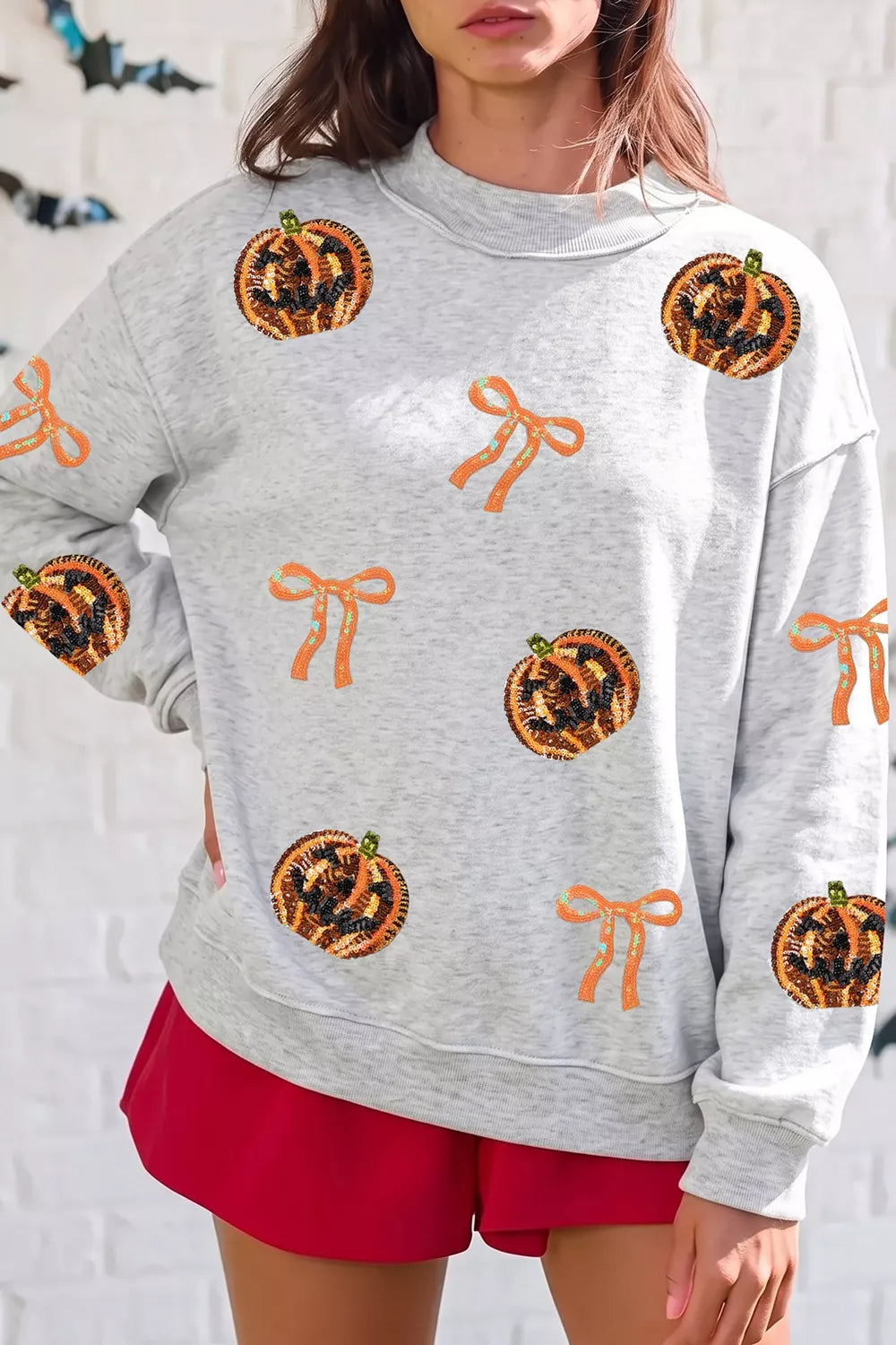Sequin Pumpkin Face Bow Exposed Seam Halloween Sweatshirt - Lilixa.store