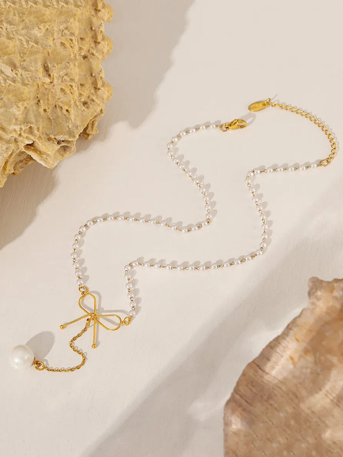 Stainless Steel Bow Pendant Necklace with Pearls in Gold