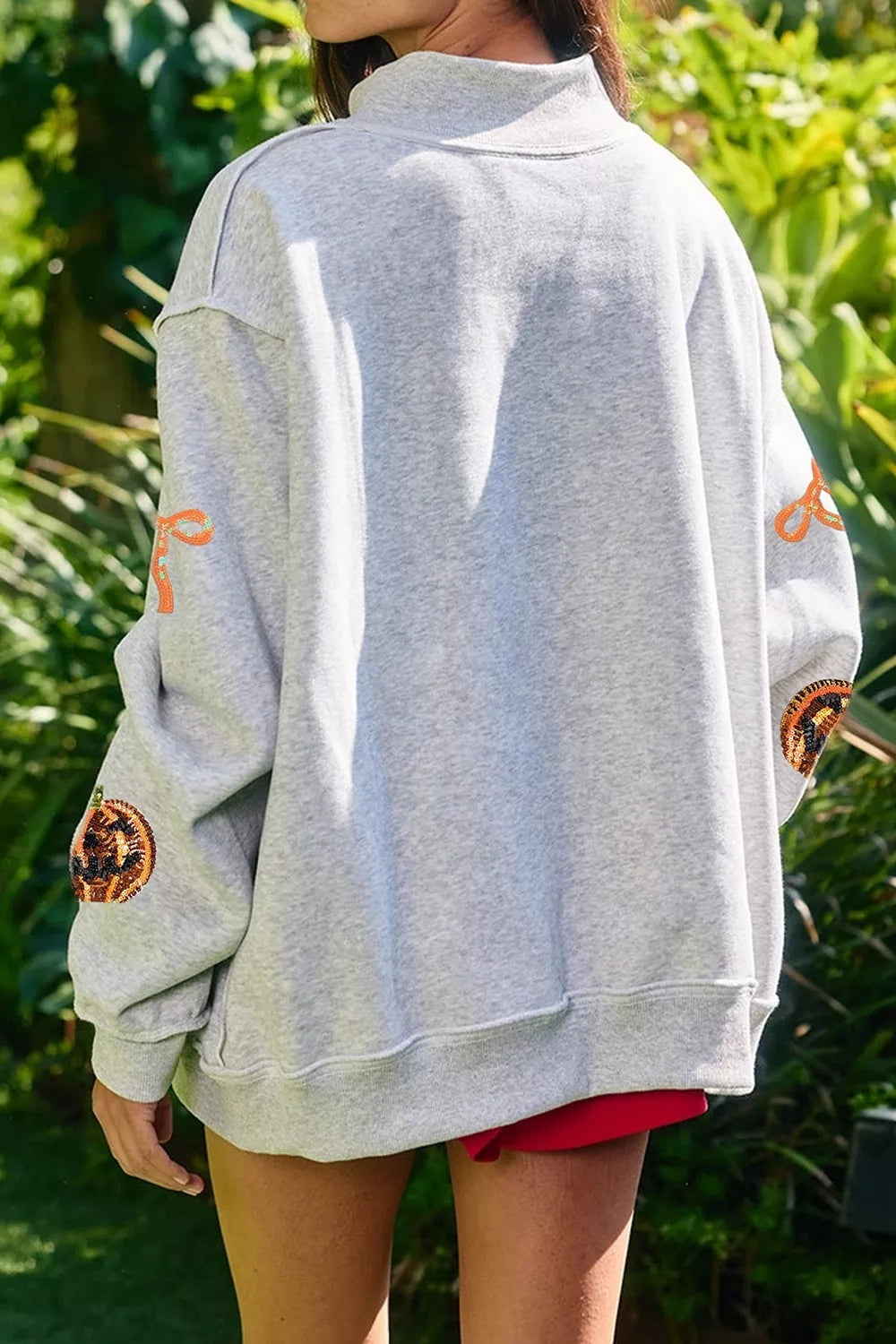 Sequin Pumpkin Face Bow Exposed Seam Halloween Sweatshirt - Lilixa.store