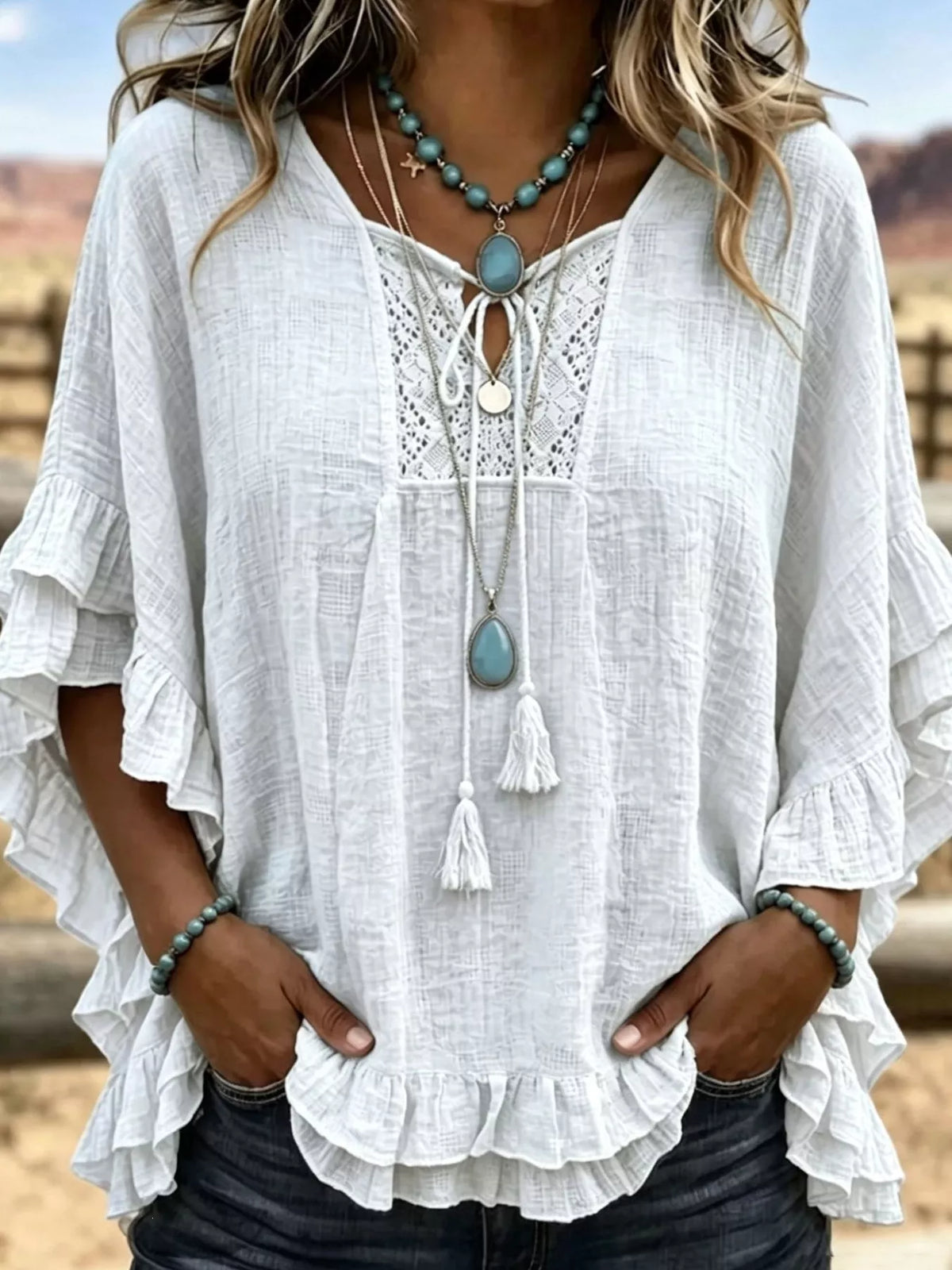 Full Size Tassel Tie Neck Ruffled Hem Blouse Plus Size - Lilixa.store