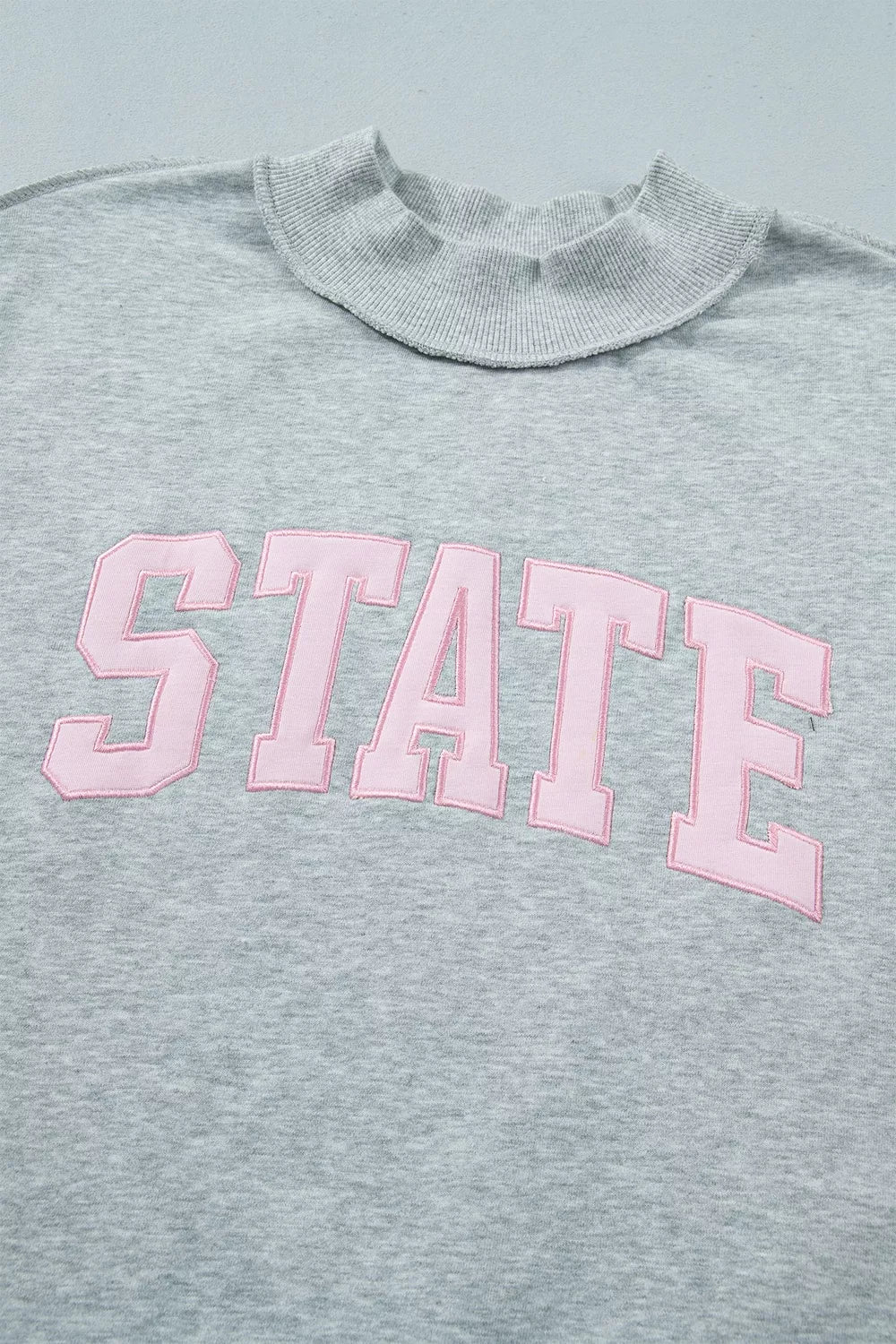 Exposed Seam Mock Neck STATE Letter Graphic Loose Sweatshirt
