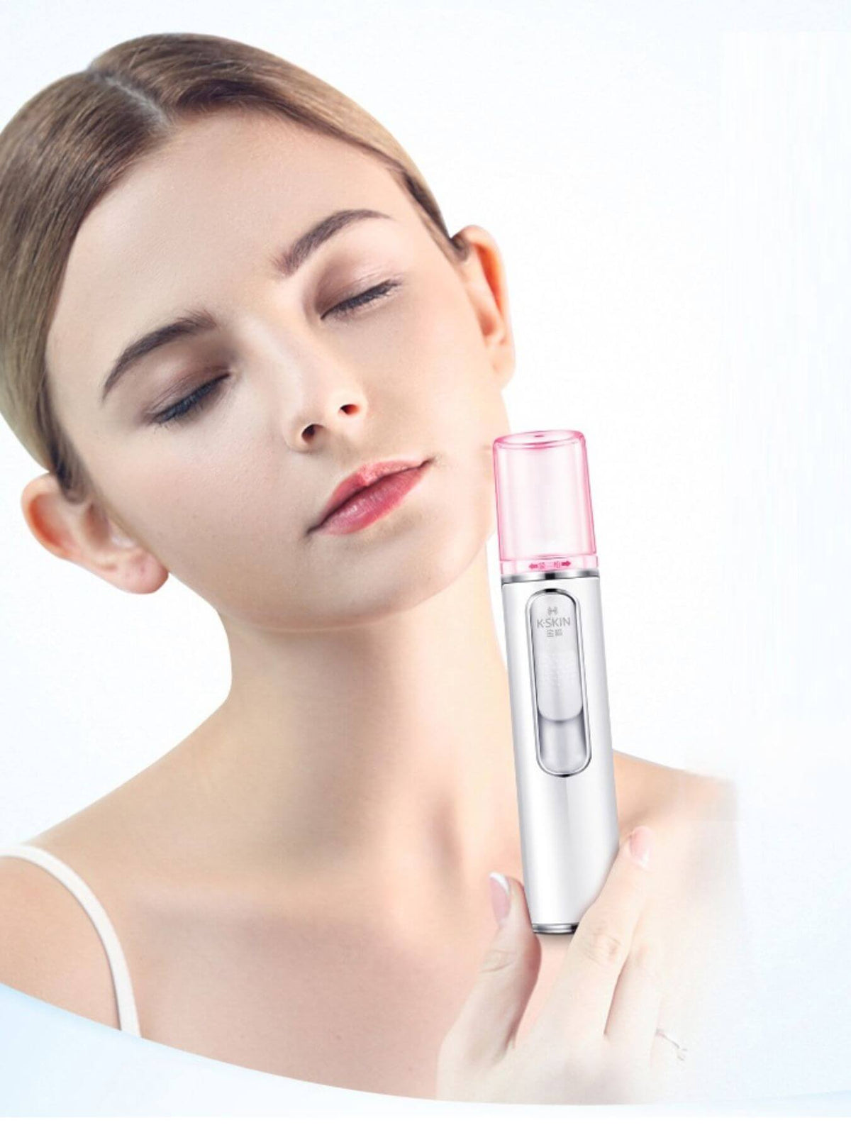 A woman using a Portable Facial Mister Nano Sprayer for skincare, showcasing its sleek design and effectiveness.