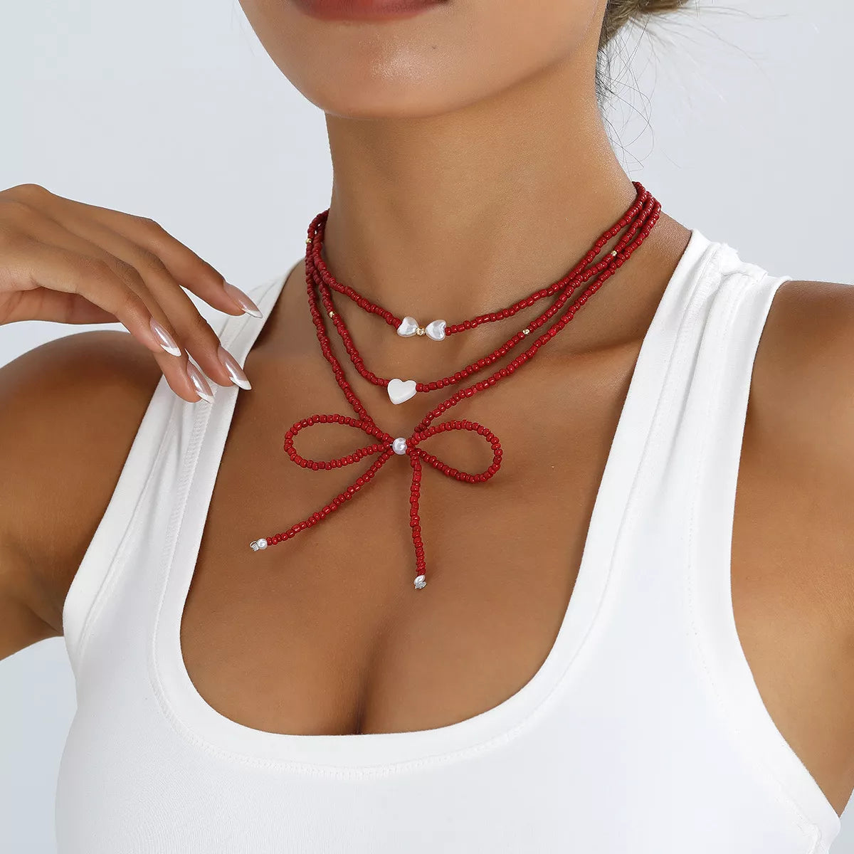 Beaded Bow Necklace with Heart Pendants - Lilixa.store