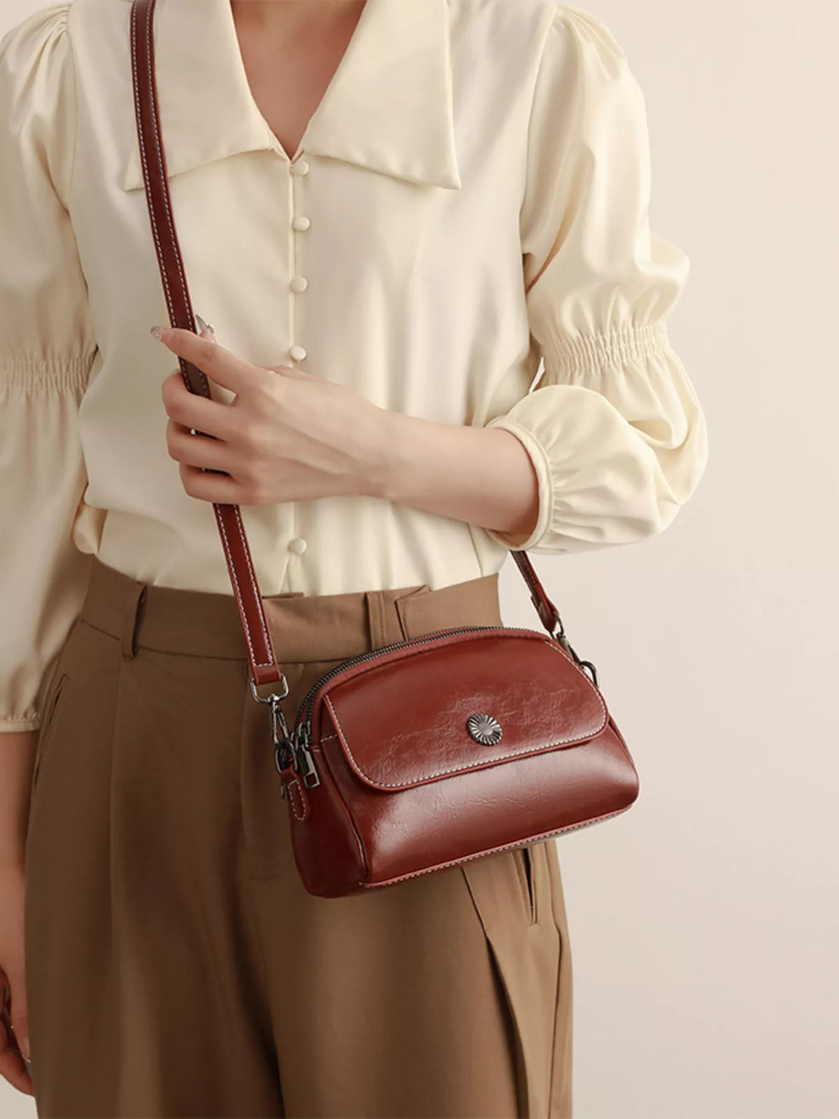 PU Leather Crossbody Bag with Metal Emblem Detail in Brown