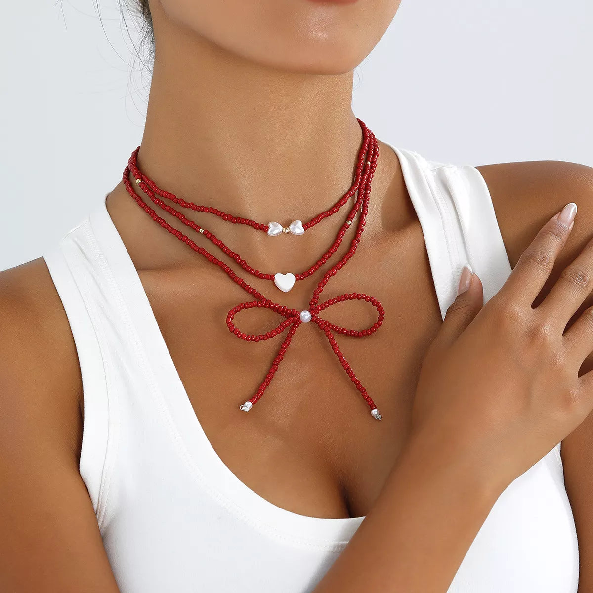 Beaded Bow Necklace with Heart Pendants - Lilixa.store