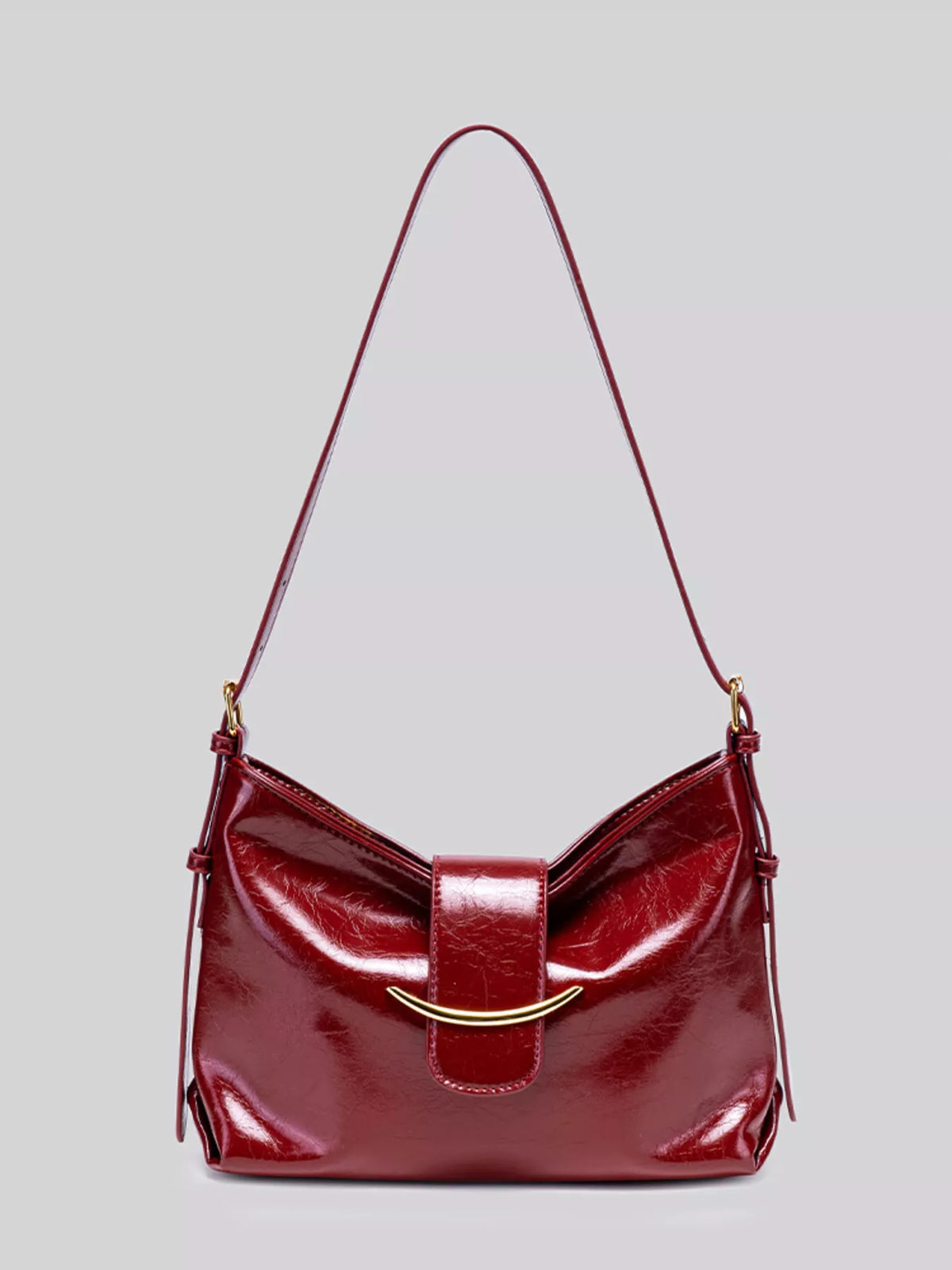 Elegant Glossy Patent Leather Shoulder Bag with Crescent Gold Accent in Wine Red