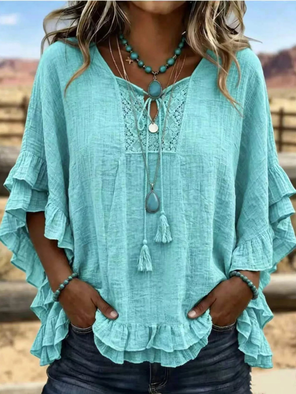 Full Size Tassel Tie Neck Ruffled Hem Blouse Plus Size - Lilixa.store