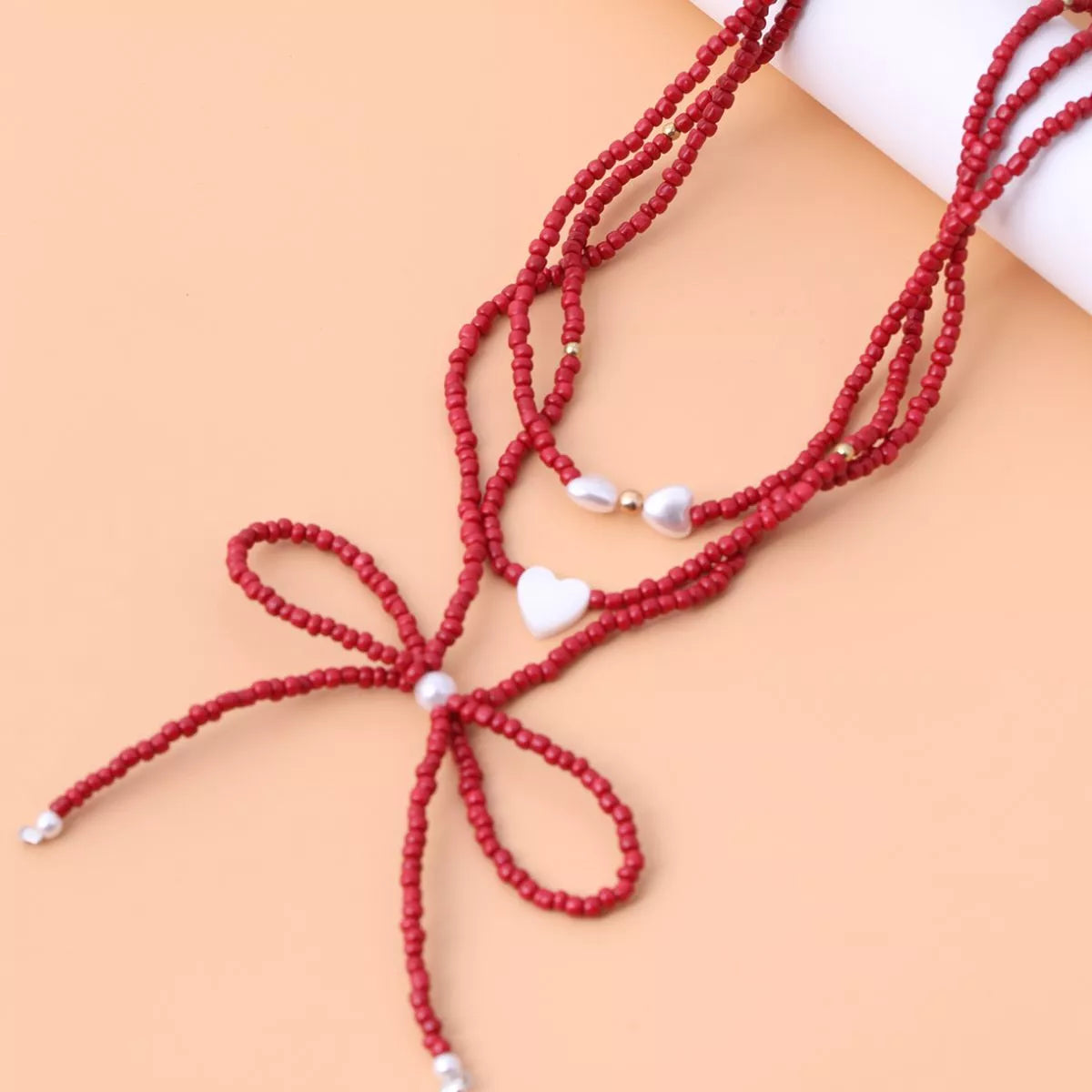 Beaded Bow Necklace with Heart Pendants - Lilixa.store