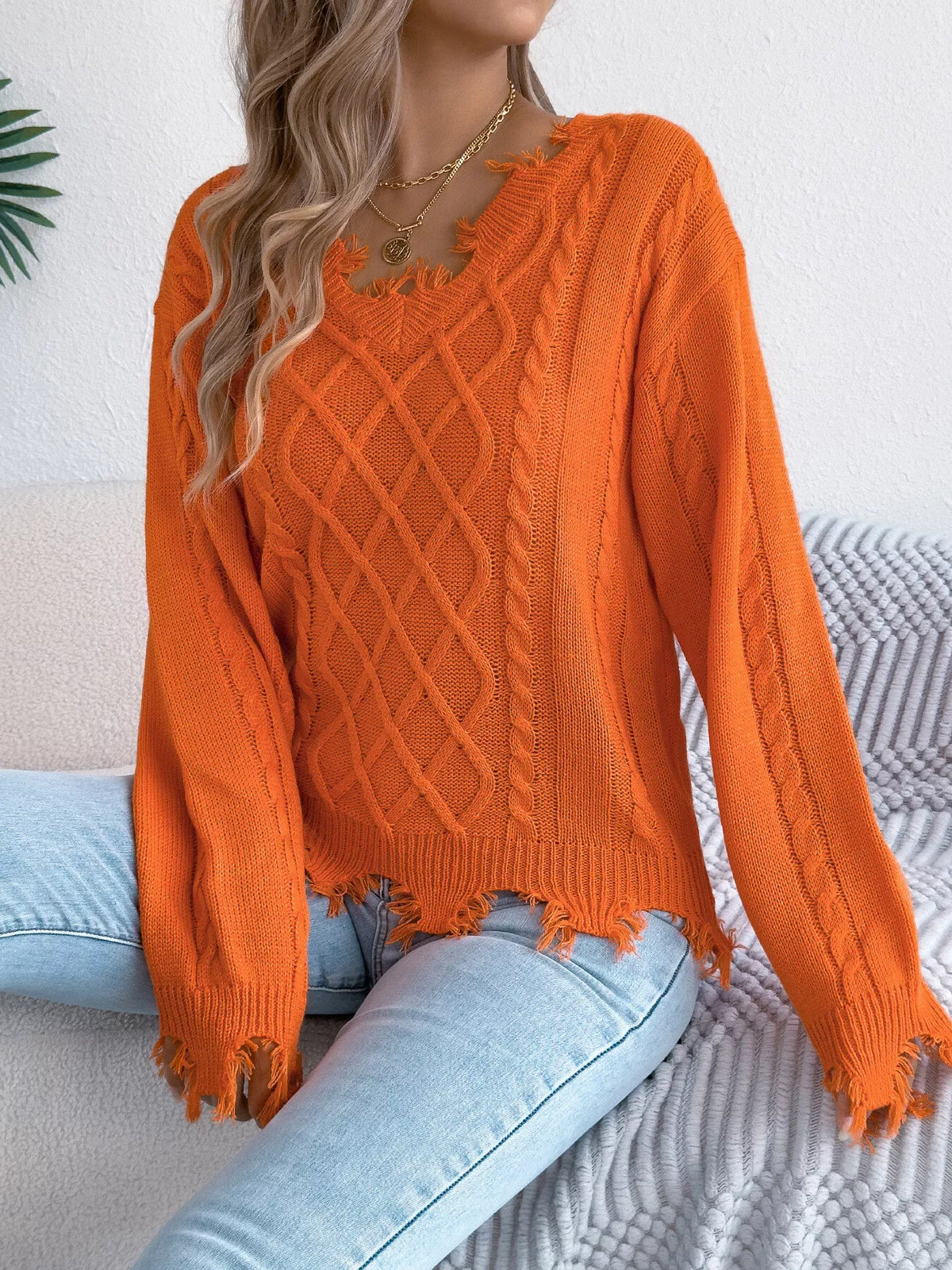 V-Neck Distressed Hem Cable Knit Sweater