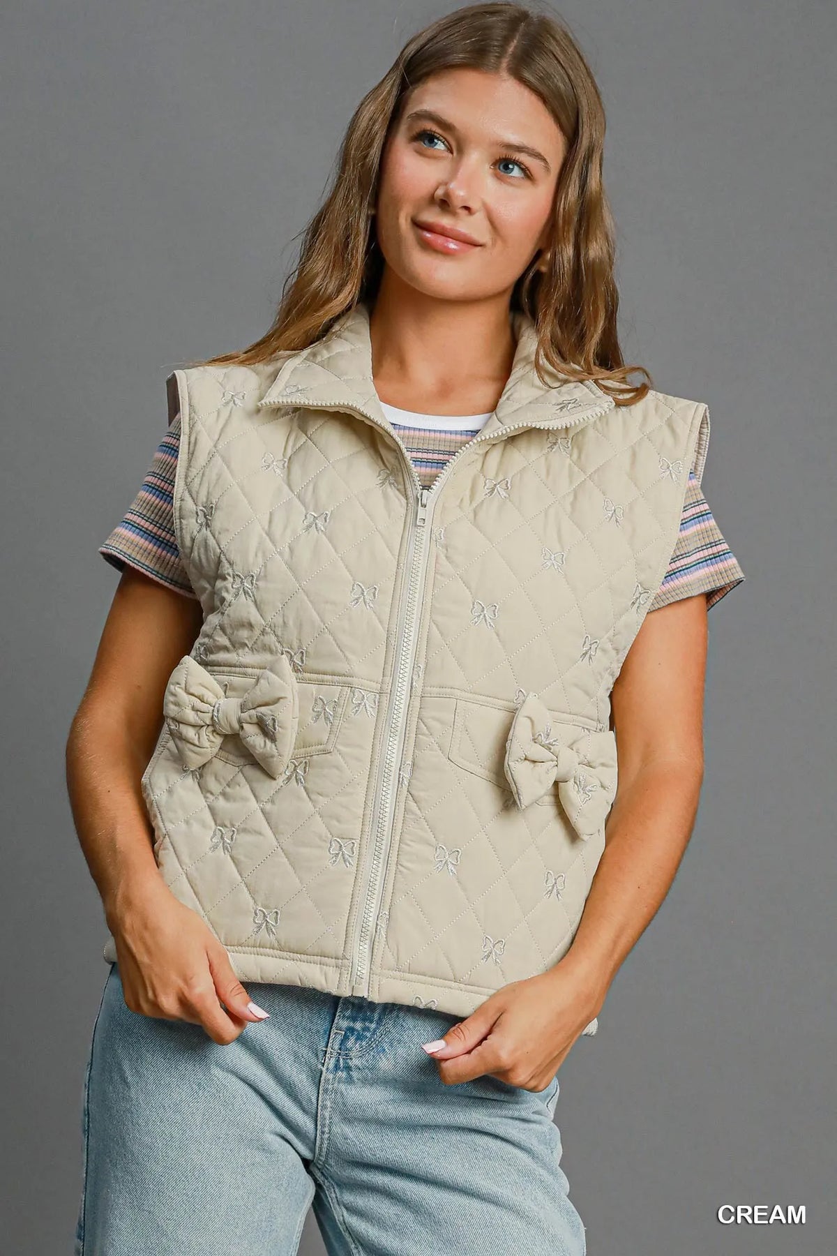 Umgee Sleeveless Quilted Vest with Bow Details in Cream